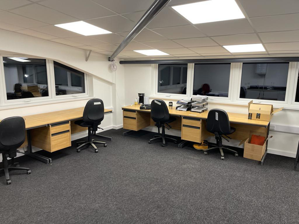 Chairs and desks placed inside a school workshop